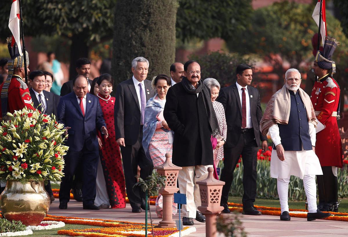 India's Prime Minister Narendra Modi (R) and Indian Vice President Venkaiah Naidu (C, in black) with other ASEAN head of states arrive to attend the "At Home" reception at the Rashtrapati Bhavan presidential palace after the Republic Day parade in New Delhi, India, January 26, 2018