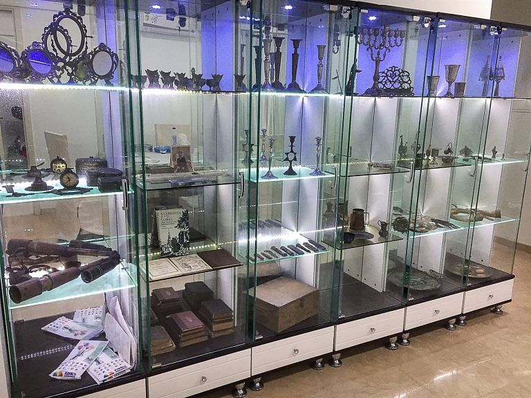 This cabinet filled with Judaica dating as far back as the 1700s is displayed at the home of Davvid’s mother, Sarah.