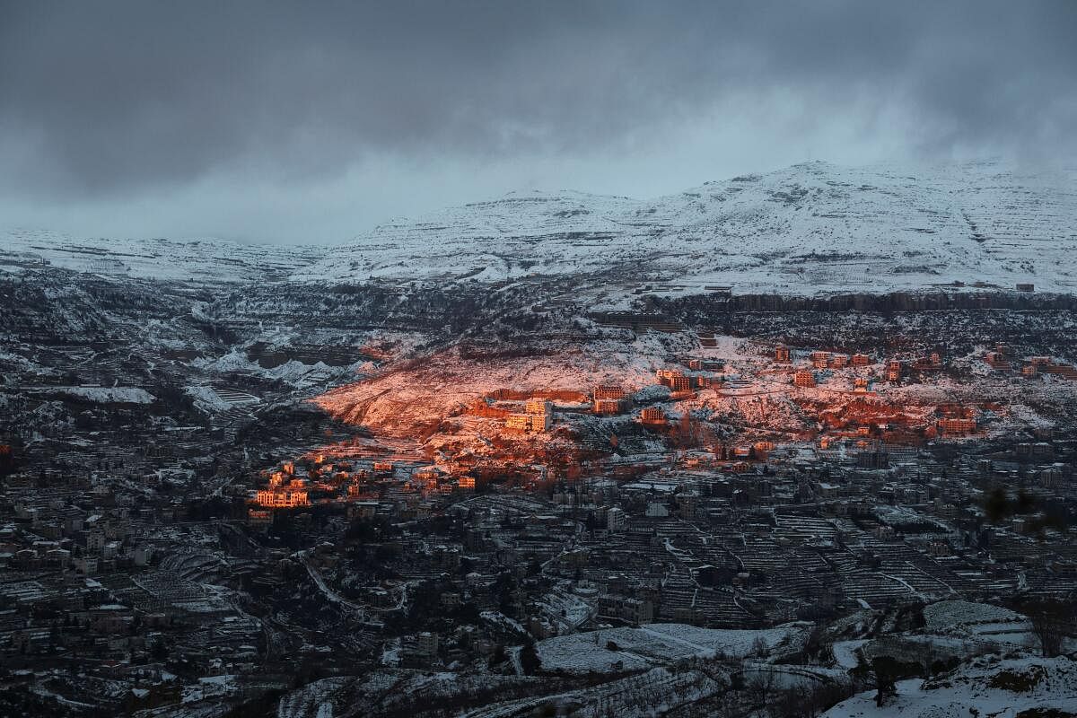 A view shows snow-covered trees and houses in Faraya as seen from Kfardebian, mount Lebanon.