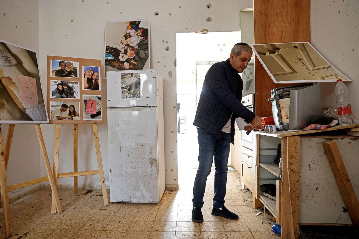 Avi Hasidim visits the apartment in which his son, Naor Hasidim, and Naor's girlfriend, Sivan Elkabets, were killed during the deadly October 7 attack by gunmen from Palestinian Islamist group Hamas, in Kibbutz Kfar Aza in southern Israel January 3, 2024. 