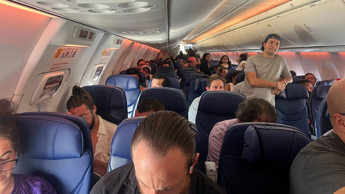 Man held for walking on Aeromexico plane wing; co-passengers on-board say 'he saved our lives'