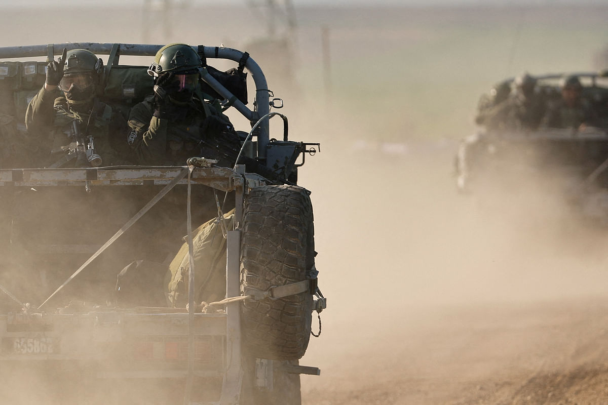 Israeli soldiers ride in military vehicles near the Israel-Gaza border, amid the ongoing conflict between Israel and the Islamist group Hamas, in Israel, January 19, 2024.