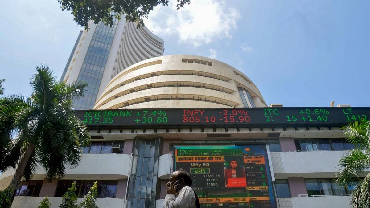 Sensex, Nifty eke out gains to settle at fresh lifetime highs