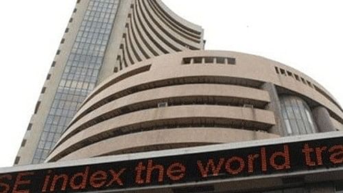 Sensex edges lower 15 points, Nifty retreats from record highs to end flat