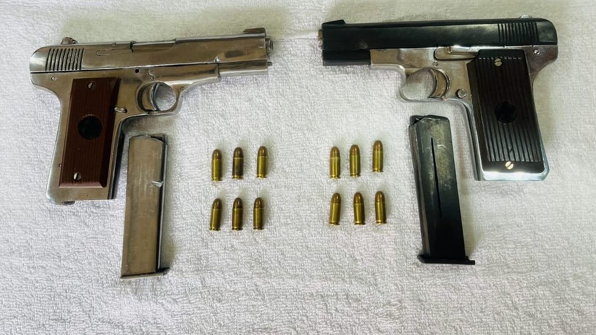Two pistols along with 12 live cartridges were  recovered from the accused.