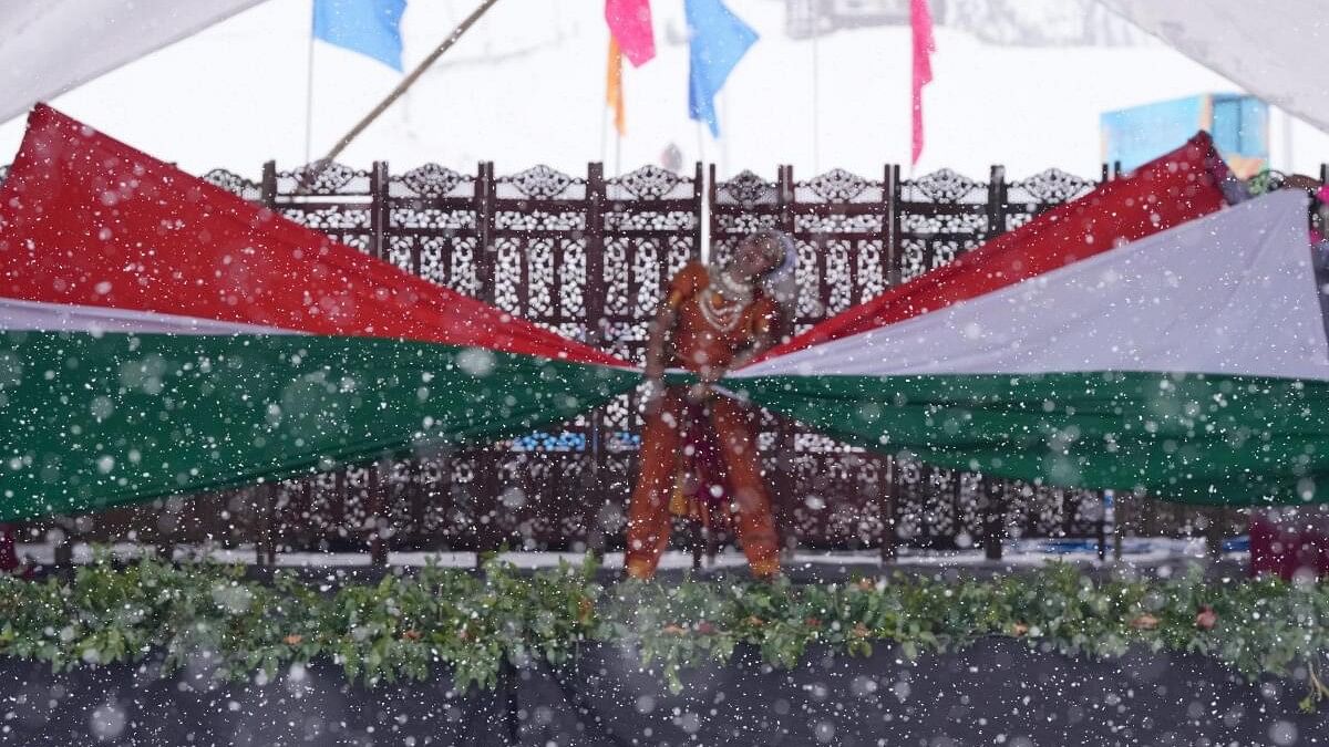 An artist performs during the opening ceremony of the 4th Khelo India Winter Games, at Gulmarg in Baramulla district.