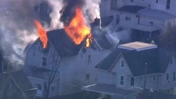 At least 6 said to be missing in Pennsylvania after fire at home where 2 police officers were shot