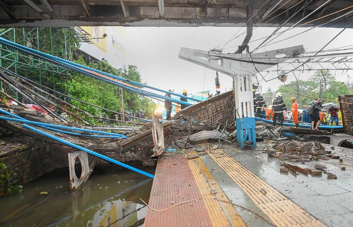 A part of the Gokhale foot overbridge  collapsed on the Western Railway tracks, at Andheri station following heavy rain, in Mumbai on  July 03, 2018