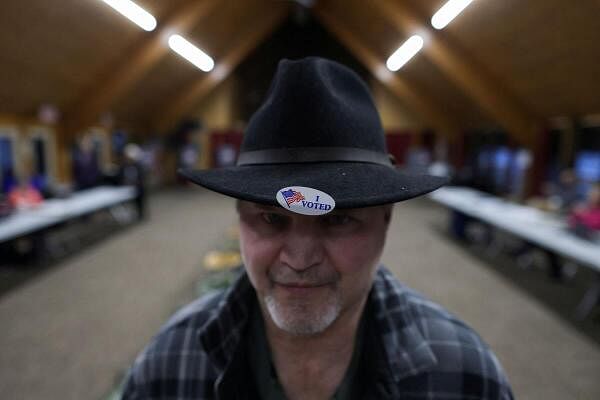 A man named John, wears an 'I voted' sticker on his hat, as Democrats and Republicans hold their primary presidential election, at Faith Lutheran Church in Grand Rapids, Michigan, U.S. February 27.
