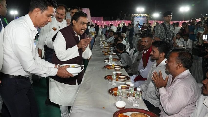 Mukesh Ambani, chairman at Reliance Industries, is seen greeting guests during ‘anna seva’ to seek blessings from various community members.