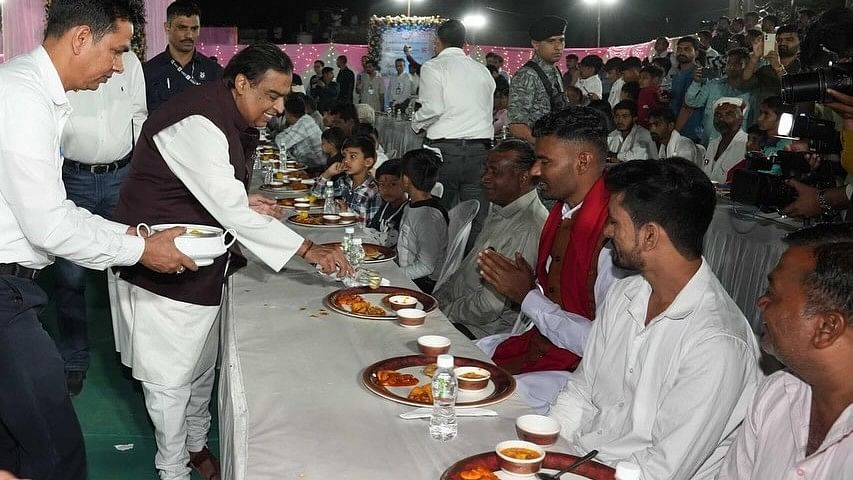 Mukesh Ambani serves traditional Gujarati food during ‘anna seva’ in Jamnagar.