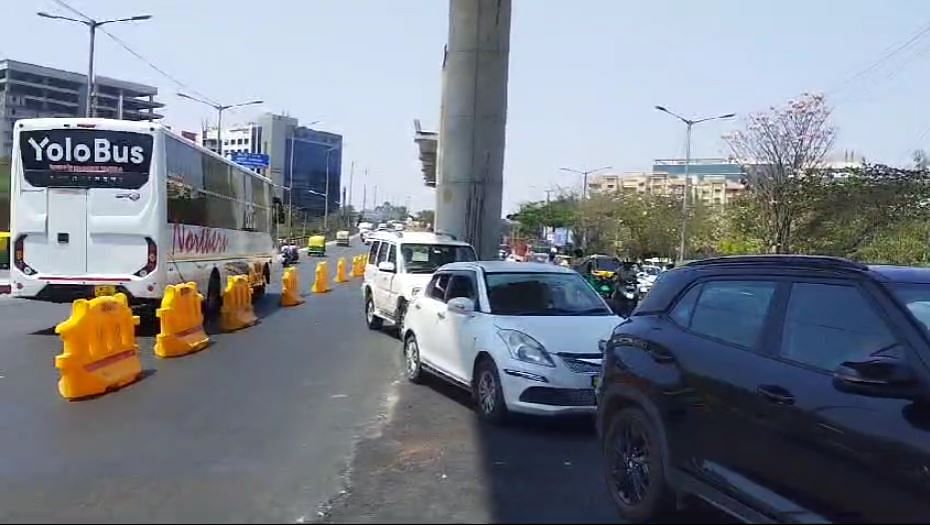 This photograph is taken near the Microsoft Corporation (India) office at Bellandur showing traffic on two lanes of the flyover going towards Silk Board (left) vehicles coming from Silk Board on the flyover (centre) and vehicles moving towards Marathahalli (right). Bengaluru Traffic Police (BTP) 