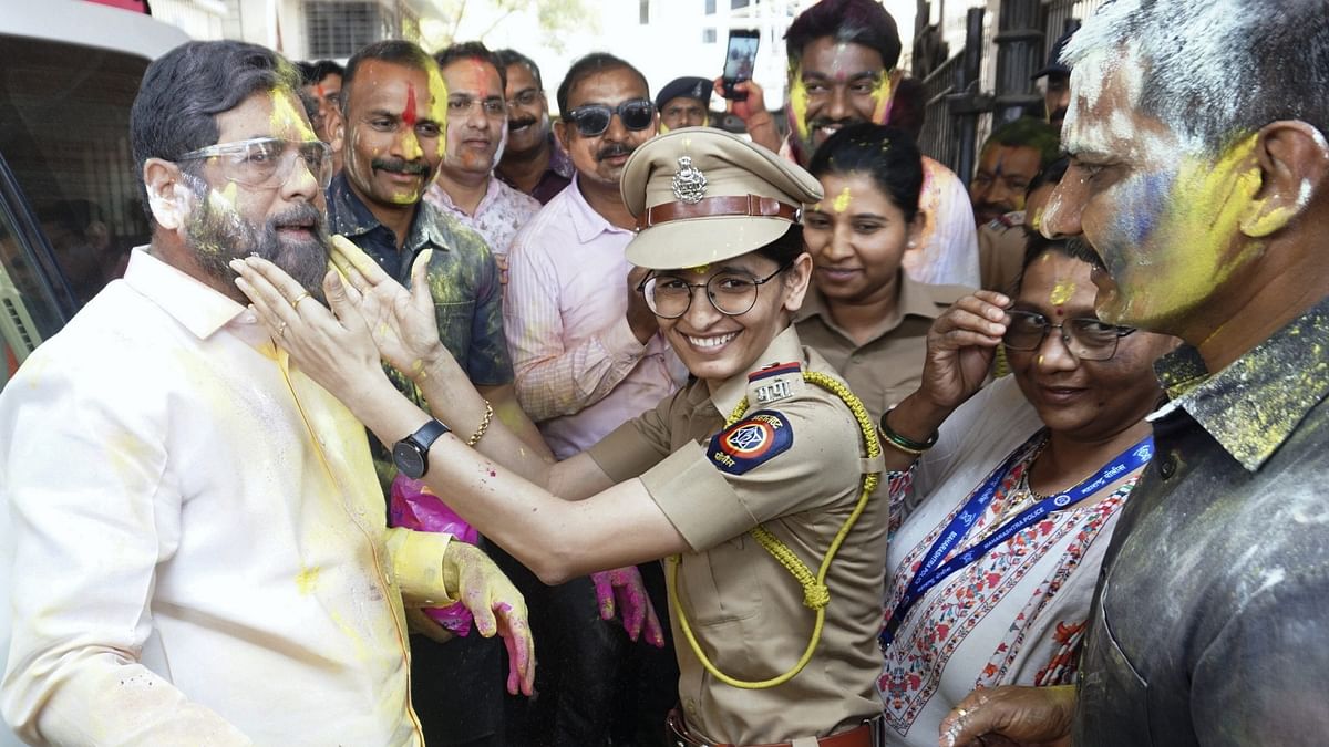 Maharashtra Chief Minister Eknath Shinde with police personnel during Holi celebrations at his Thane residence.