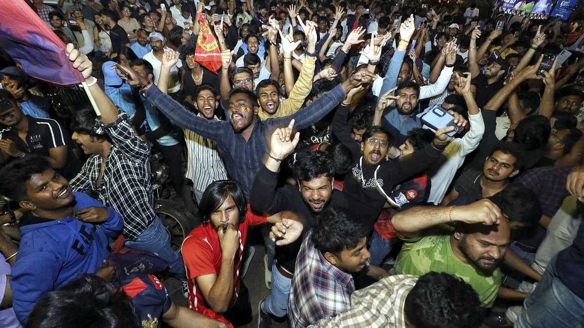 Blowing whistles, singing, dancing and shouting slogans, the supporters flooded the streets of Bengaluru celebrating the spirit of triumph.