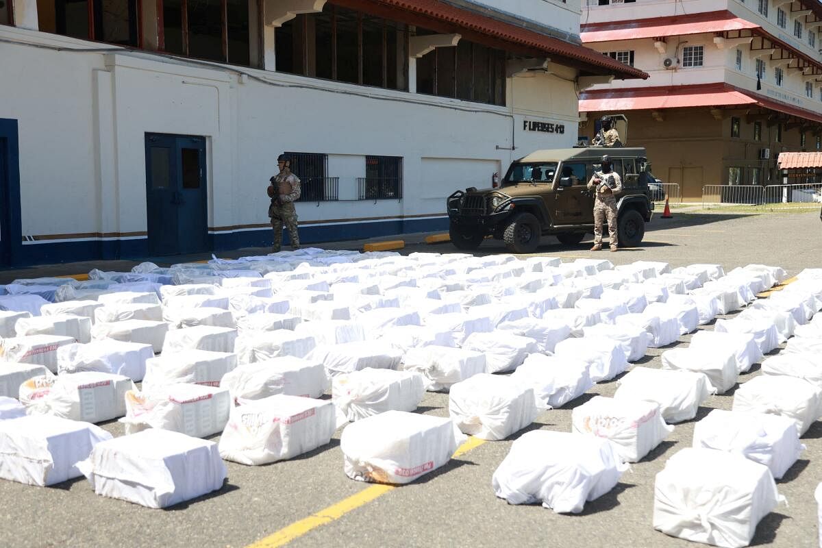 Officers of the Servicio Nacional Aeronaval (National Air-Sea Command) stand guard during the presentation of five tons of drugs seized during an operation in the Caribbean Sea, in Colon, Panama.