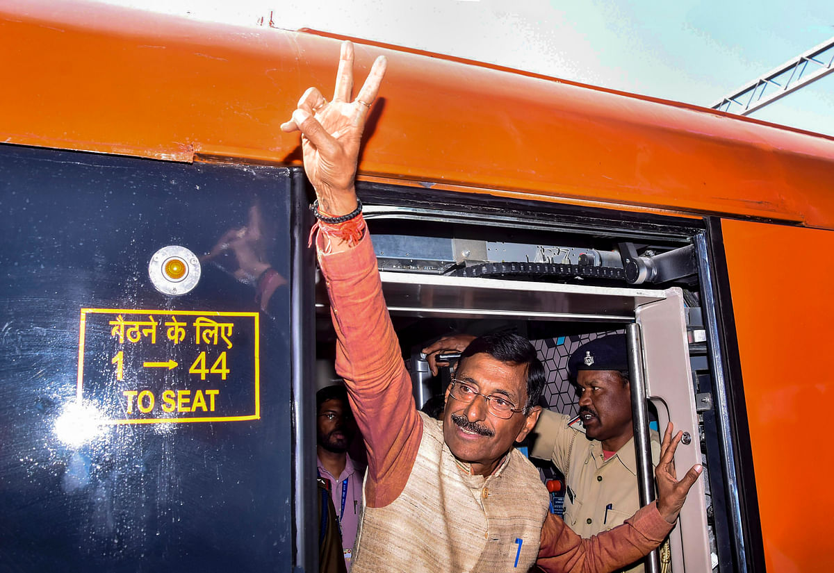 BJP MP Sanjay Seth flashes victory sign. 
