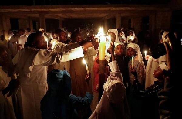 Worshippers attend Easter vigil mass at the St. Joanes, Legio Maria of African Church Mission within Fort Jesus in Kibera district of Nairobi.