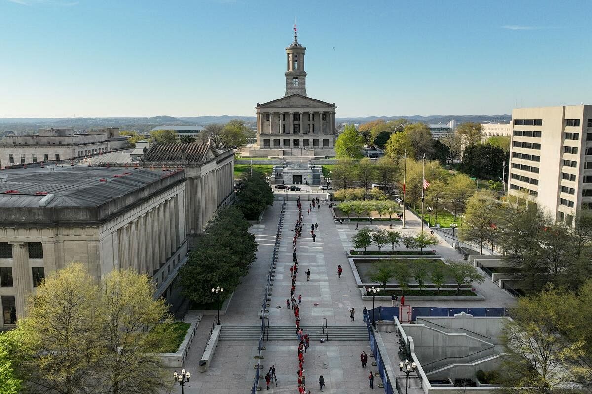 A drone view shows people forming a human chain to the Tennessee State Capital to mark the one year anniversary of the Covenant School shooting in Nashville.