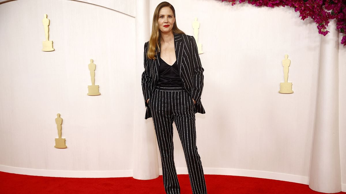Anatomy of a Fall best director nominee Justine Triet opeted for a pantsuit decorated with sparkly lines.