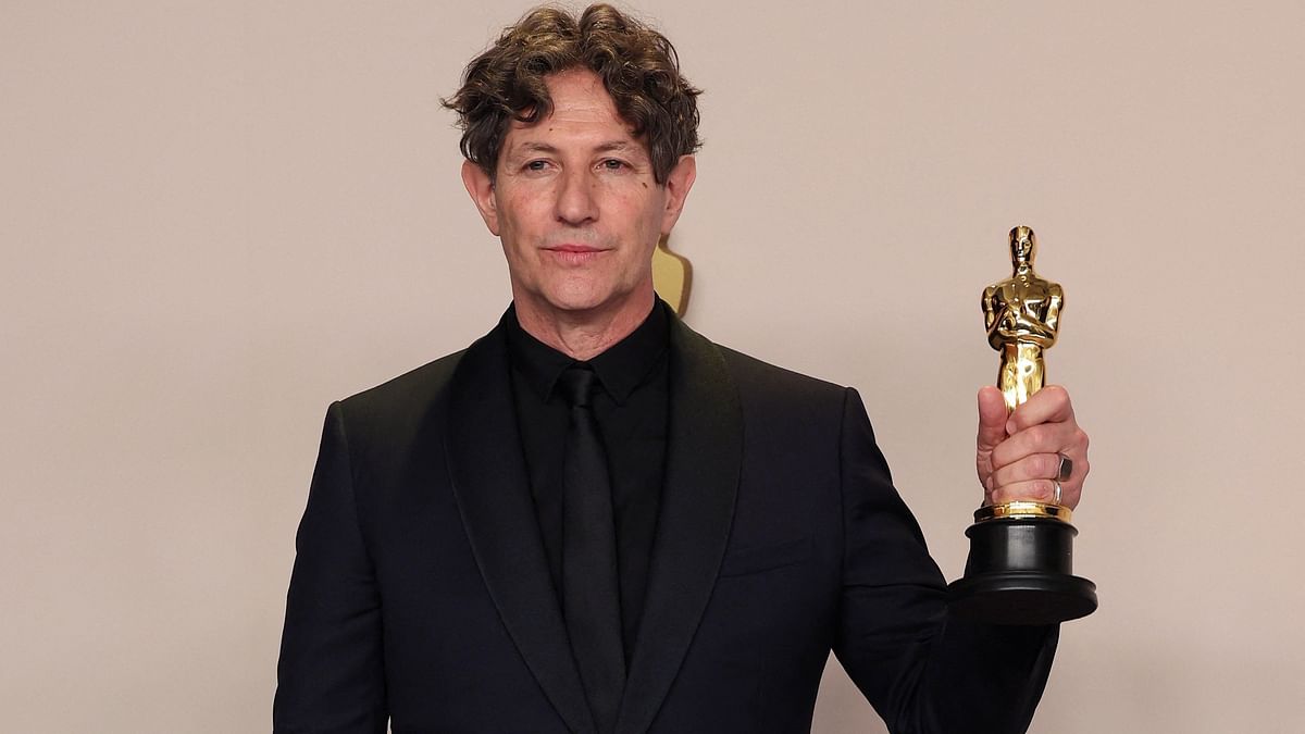The Zone of Interest of the United Kingdom was adjudged as the 'Best International Feature Film' at the 96th Academy Awards. In this photo, Director Jonathan Glazer is seen posing with the oscar.