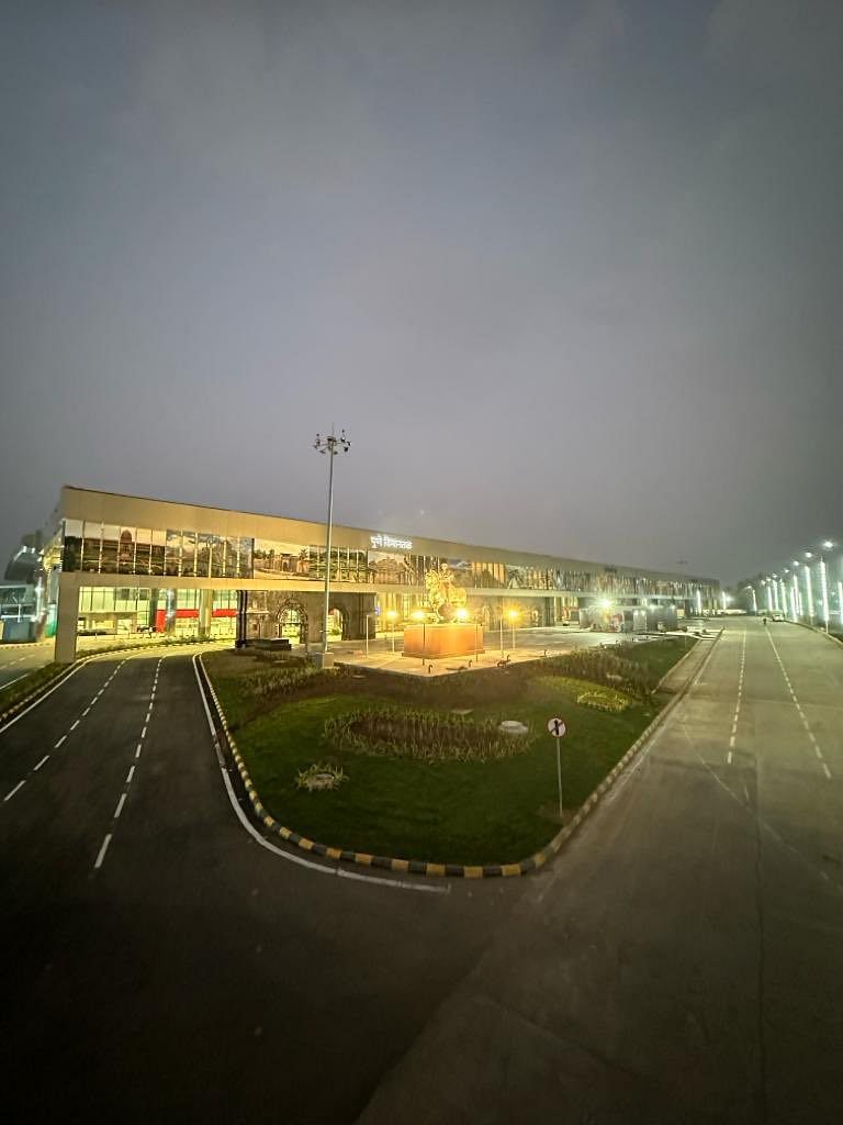 New terminal building at Pune airport lit up at night.