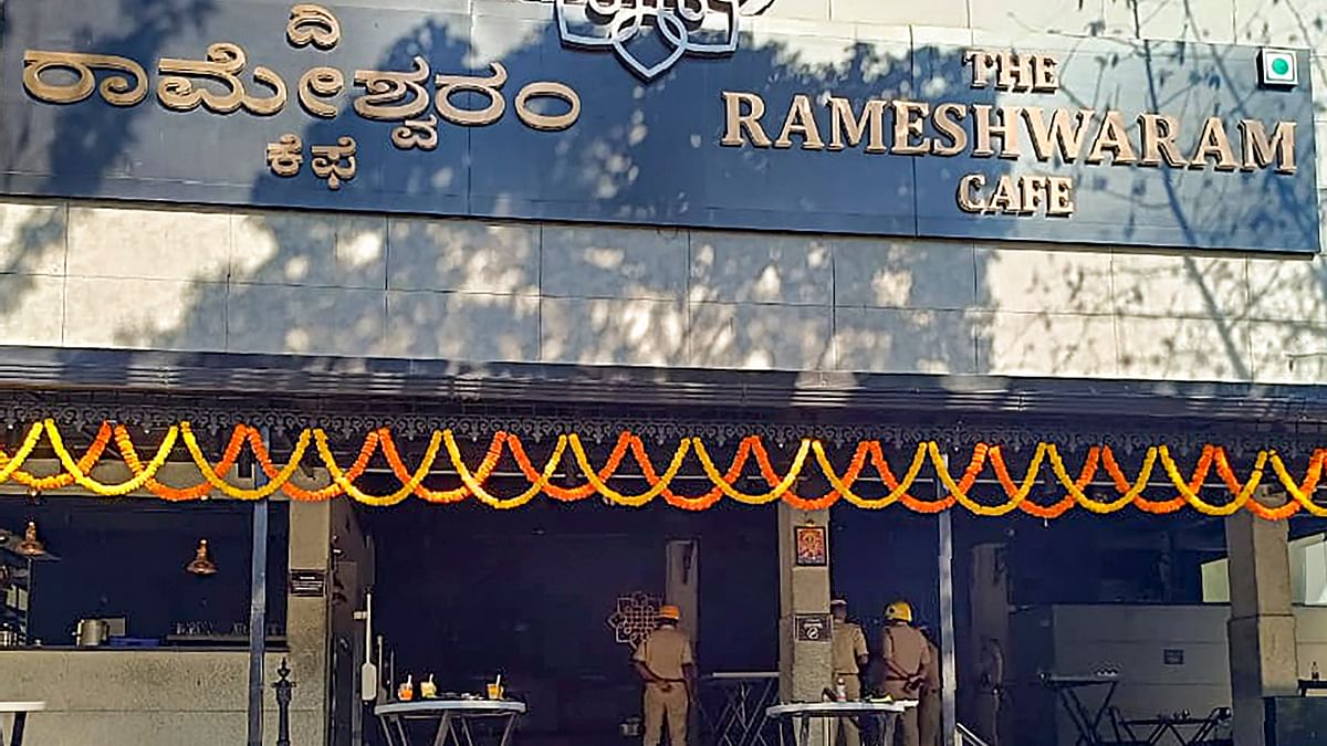 Fire fighters at the Rameshwaram Cafe, in Bengaluru.