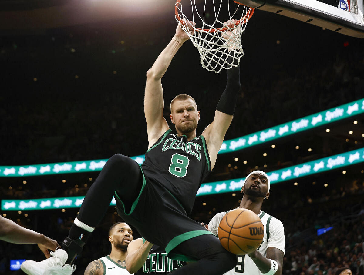 Boston Celtics center Kristaps Porzingis dunks against the Milwaukee Bucks during the second half at TD Garden. 