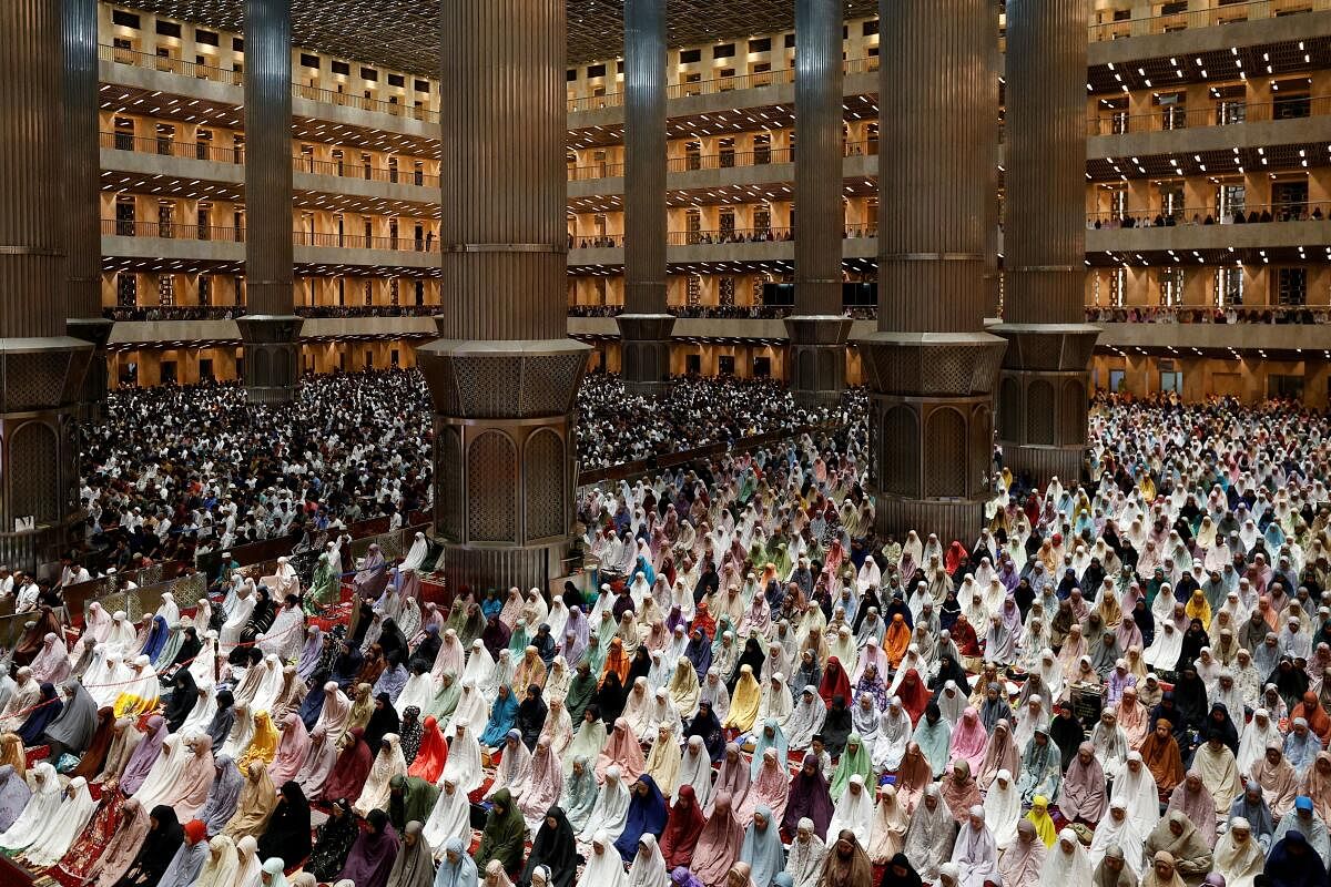 esian Muslims take part in the evening mass prayers called "Tarawih" on the first night of holy fasting month of Ramadan, at the Grand Mosque of Istiqlal in Jakarta, Indonesia, March 11, 2024.