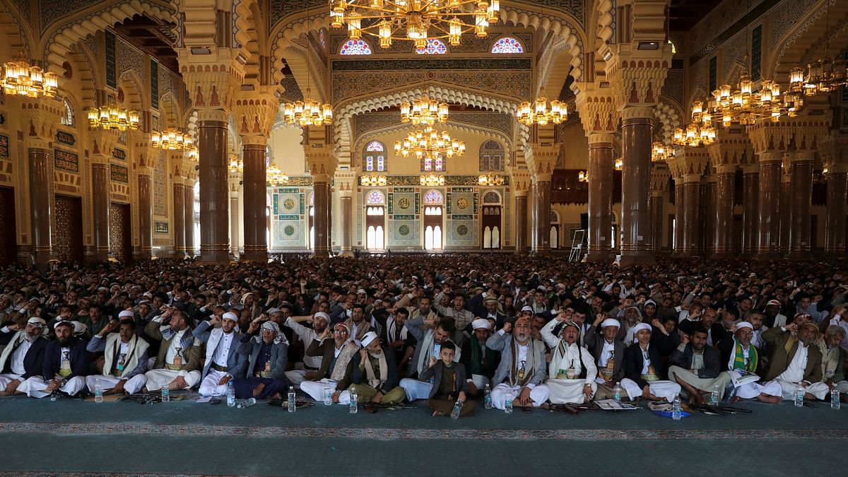 Houthi followers raise slogans as they watch a speech by their leader Abdul-Malik al-Houthi ahead of the fasting month of Ramadan, at a mosque in Sanaa, Yemen.
