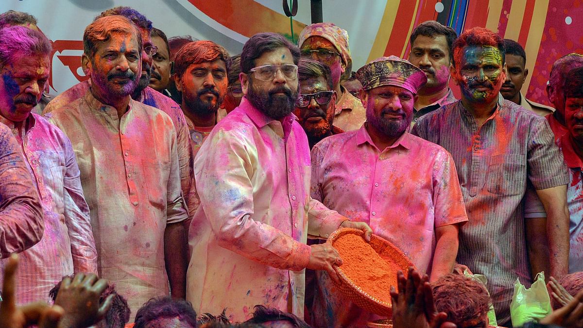 Maharashtra Chief Minister Eknath Shinde celebrates Holi with his supporters, in Thane, Mumbai.