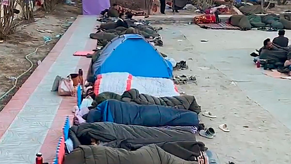 People rest during a hunger strike led by education reformist and climate activist Sonam Wangchuk on the 21st day of his 'climate fast' demanding statehood for Ladakh and its inclusion in the Sixth Schedule of the Constitution.