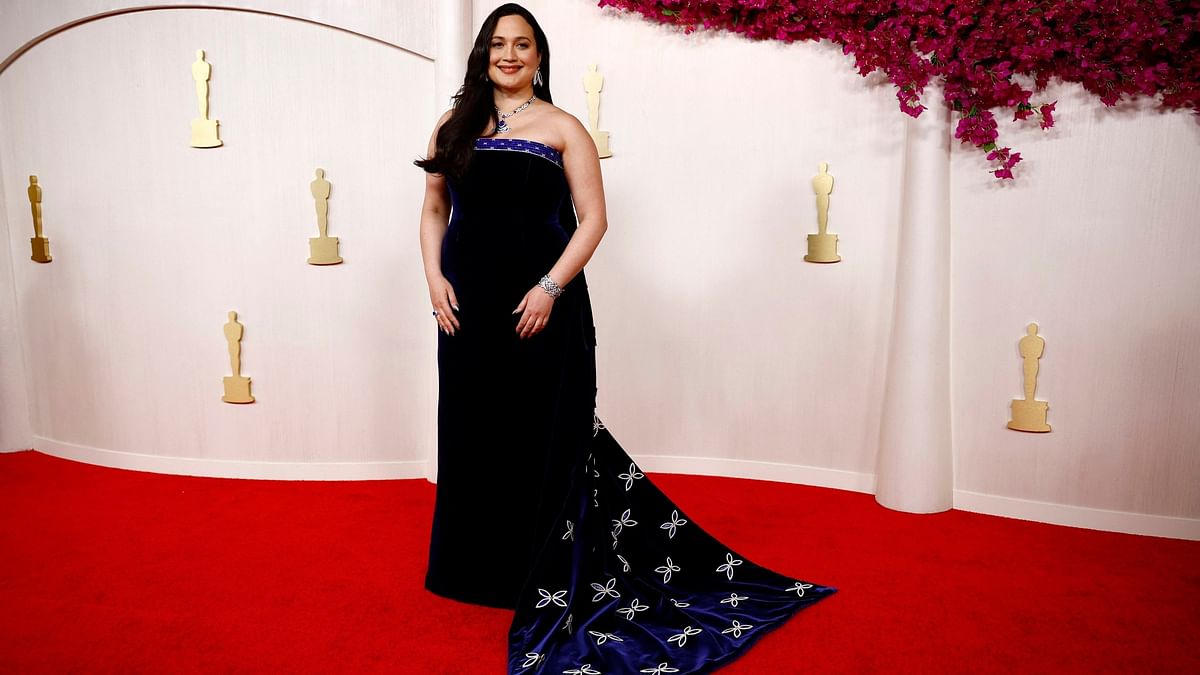 Lily Gladstone, a best actress nominee for Killers of the Flower Moon, walked the red carpet in a strapless midnight-blue velvet gown by Gucci.