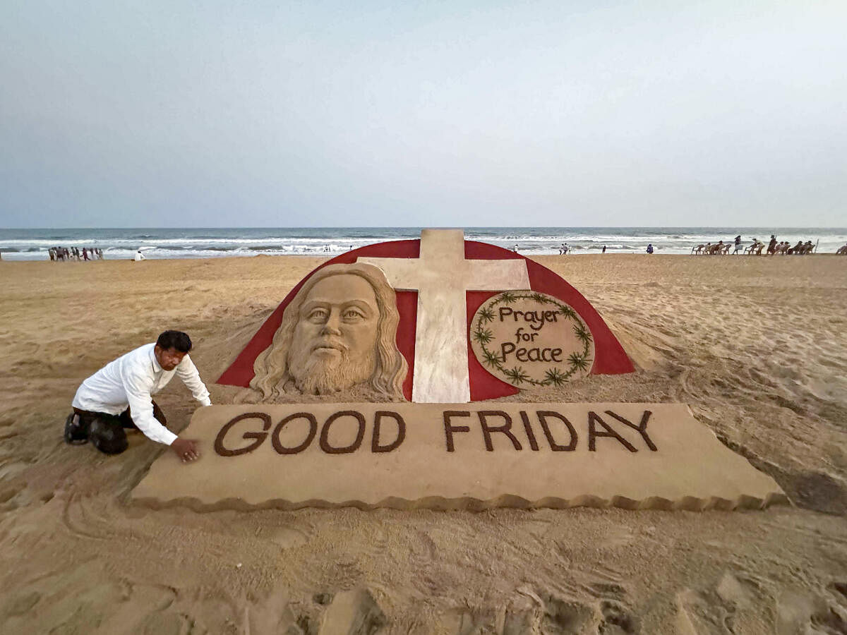 Sand artist Sudarshan Pattnaik creates a sand art with message ‘Prayer for Peace’, in Puri.
