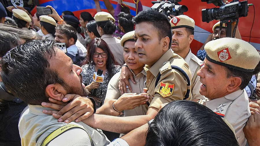 A photojournalist manhandled by Delhi police perso<em></em>nnel during protest by the Aam Aadmi Party over the arrest of Delhi Chief Minister Arvind Kejriwal by the ED, at Delhi’s Patel Chowk.