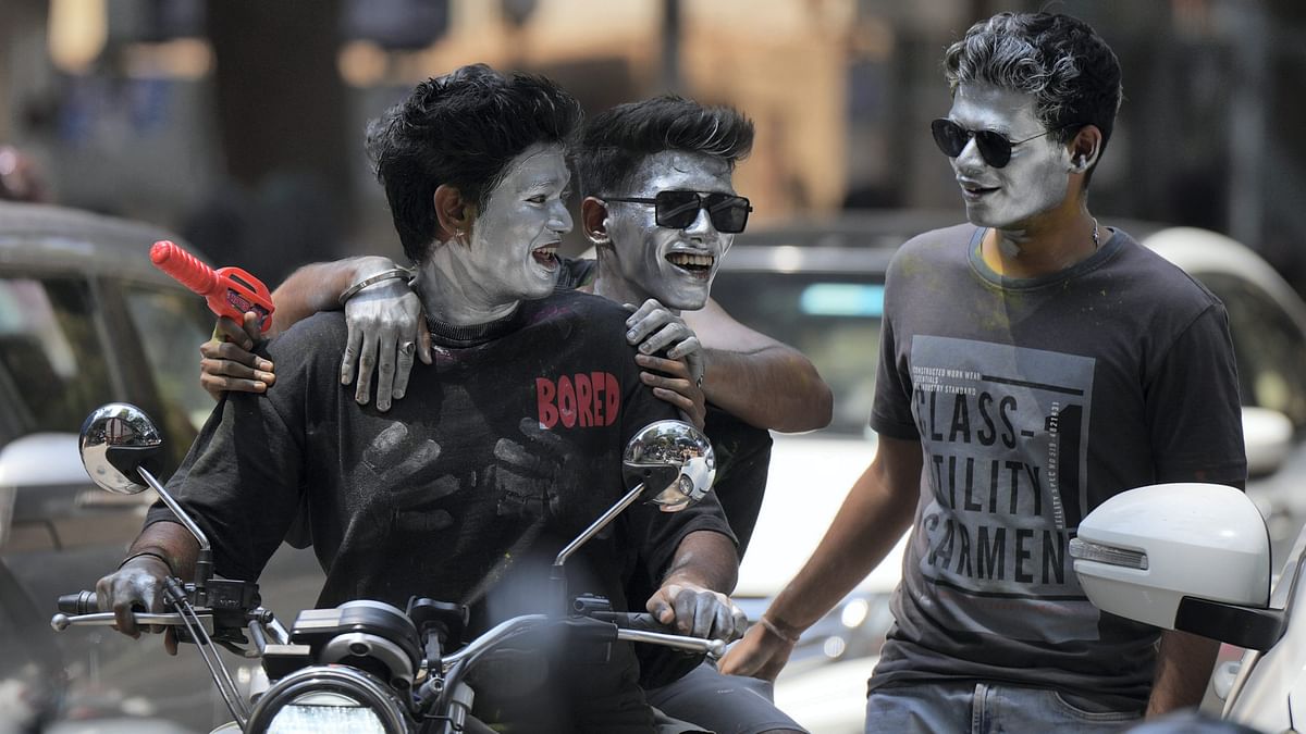 Youngsters during Holi festival celebrations, in Mumbai.