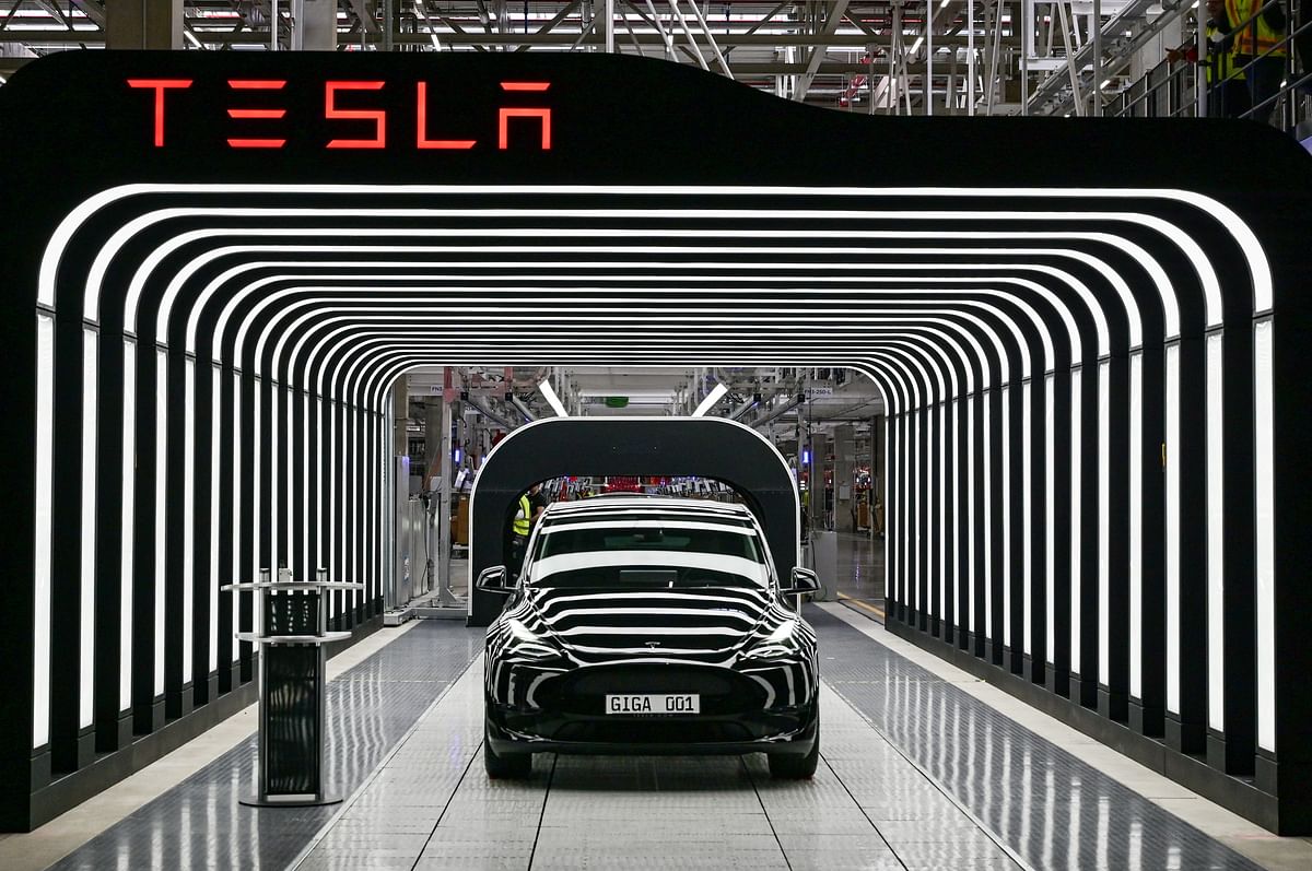 FILE PHOTO: Model Y cars are pictured during the opening ceremony of the new Tesla Gigafactory for electric cars in Gruenheide Germany March 22 2022. 
