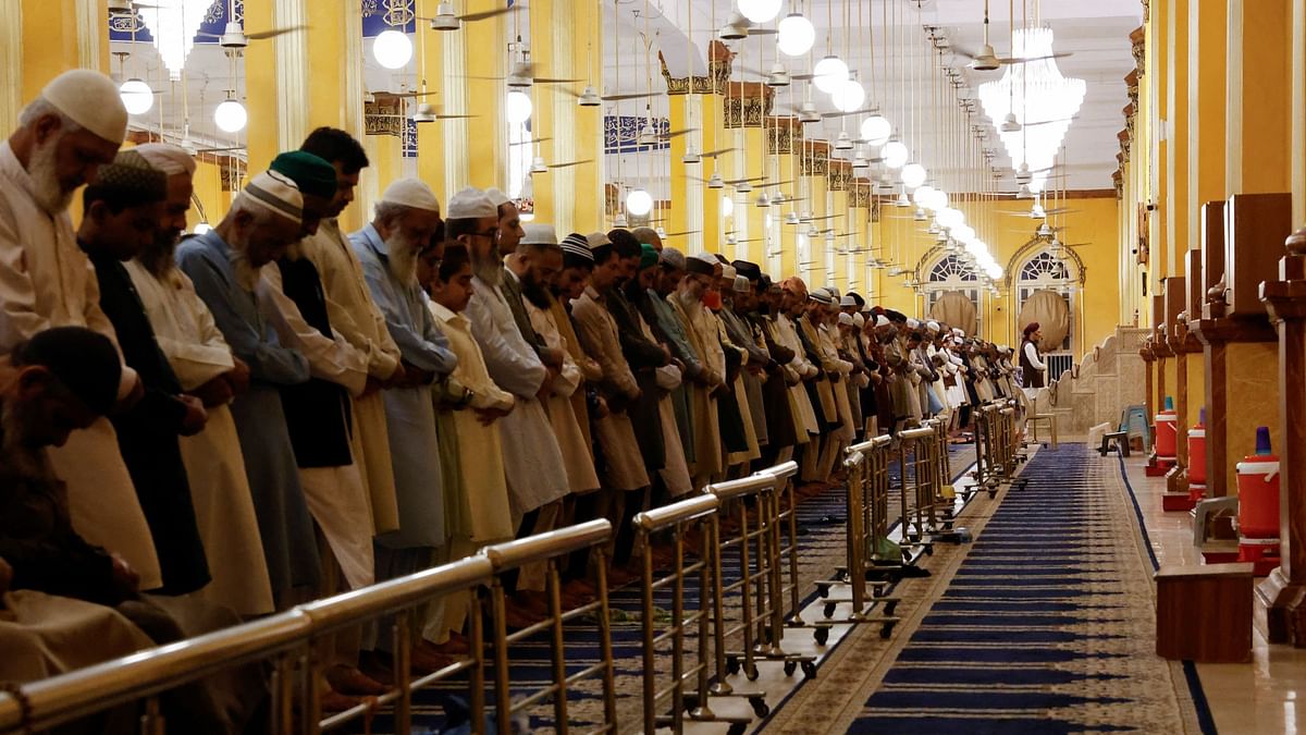 Muslims attend an evening mass prayer session called Tarawih to mark the holy fasting month of Ramadan in Karachi, Pakistan.