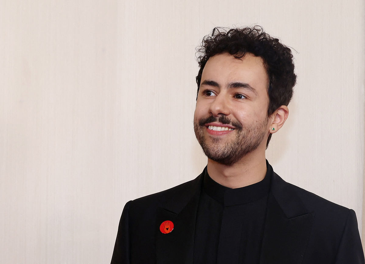 American comedian and actor Ramy Youssef was one of the stars who was spotted wearing a red pin to his lapel.