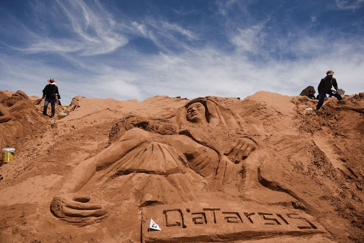 Bolivians commemorate Holy Week by sculpting surprising figures in the sand, in Oruro.