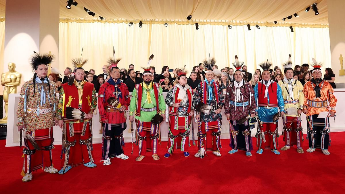 Members of the 'Osage Nation', who sang the nominated best song from "Killers of the Flower Moon," graced the red carpet in colourful tribal dresses.