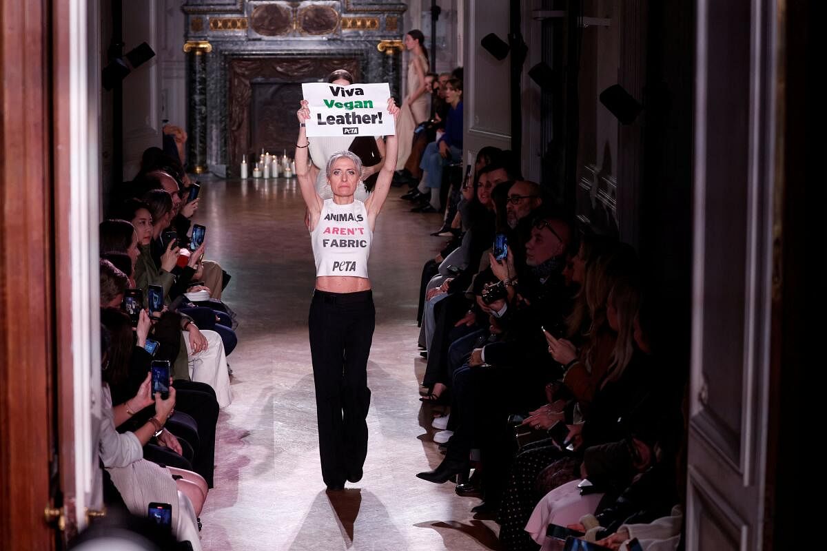 An activist from the animal rights group PETA (People for the Ethical Treatment of Animals) protests during designer Victoria Beckham's Fall-Winter 2024/2025 Women's ready-to-wear collection show at the Paris Fashion Week.