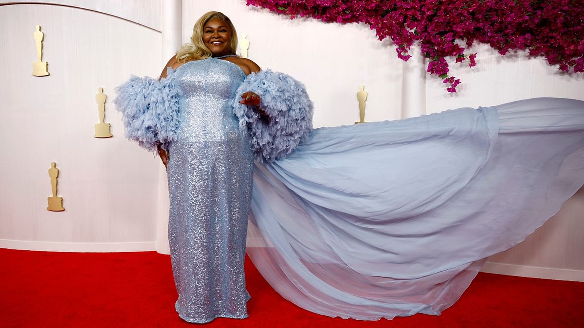Da'Vine Joy Randolph, who won the best supporting actress Oscar for her role in The Holdovers, sparkled in a light blue gown with voluminous feathery sleeves.