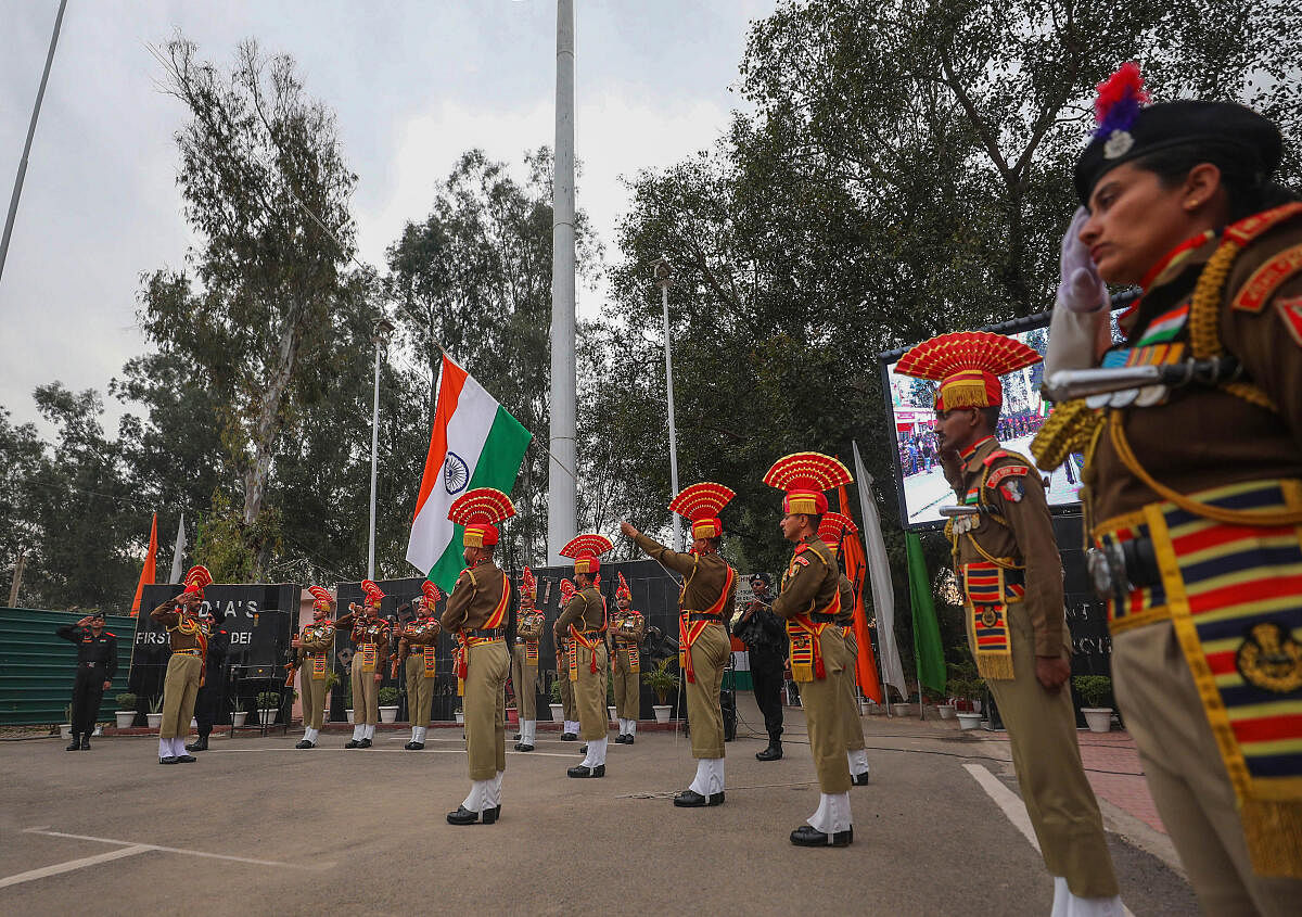 BSF personnel perform during the Beating Retreat ceremony at the International Border Octroi Post, Suchetgarh, on the outskirts of Jammu.