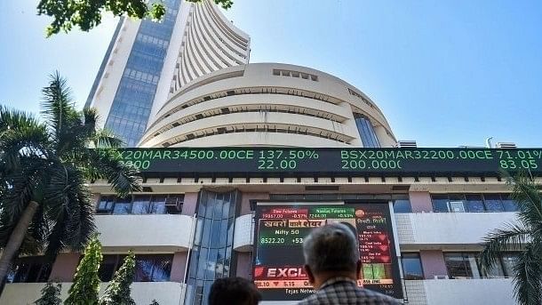 Stock markets settle higher in volatile trade; metal, auto shares shine