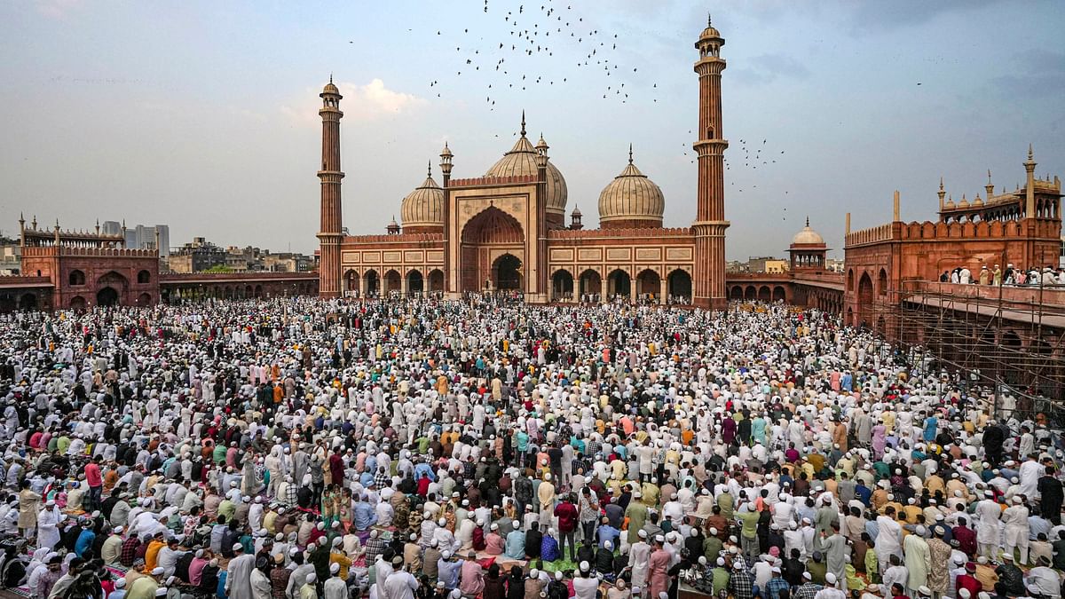 Muslims assemble to offer namaz at the Jama Masjid on the occasion of the Eid-ul-Fitr festival, in New Delhi.