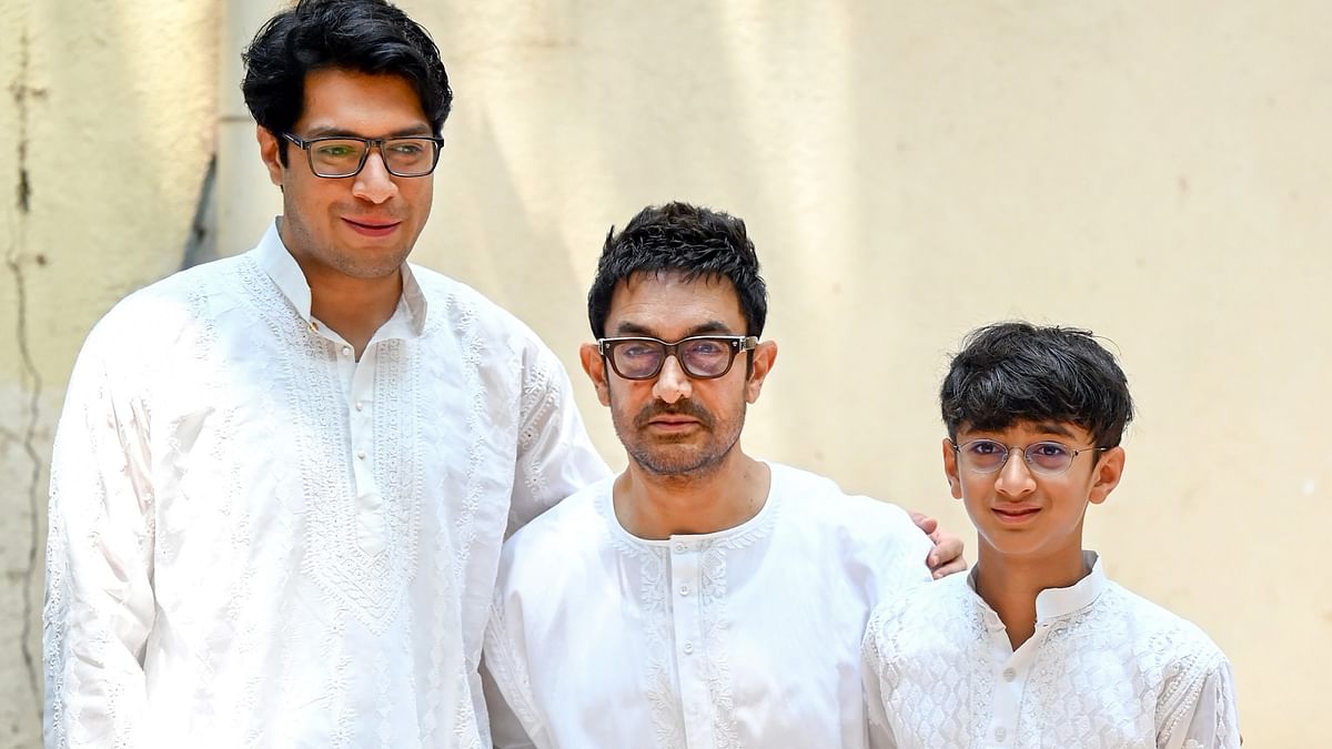 Aamir Khan celebrated Eid with media and distributed sweets. He also posed for the shutterbugs with his sons Junaid and Azaad.