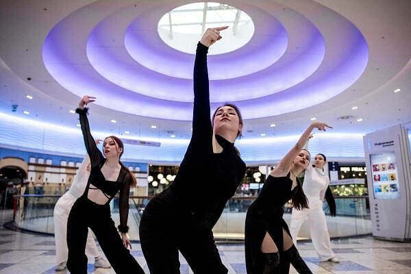 Members of the band GeneSiS dance while they record a one-take cover dance video, in a shopping mall in Moscow, Russia.