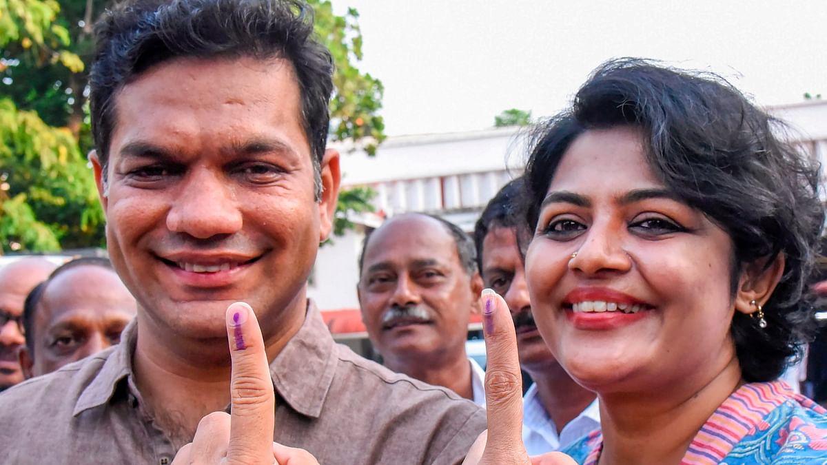 United Democratic Front (UDF) candidate Hibi Eden and wife Anna Eden show their ink-marked fingers after casting vote for the second phase of Lok Sabha elections, at Ernakulam, Kerala.