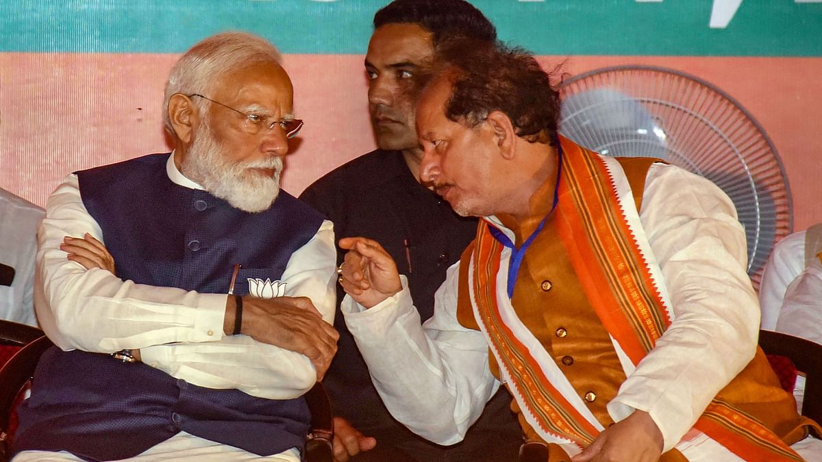 Prime Minister Narendra Modi is seen having a deep conversation with Bihar Deputy Chief Minister Vijay Kumar Sinha during a public meeting, ahead of Lok Sabha elections, in Gaya.