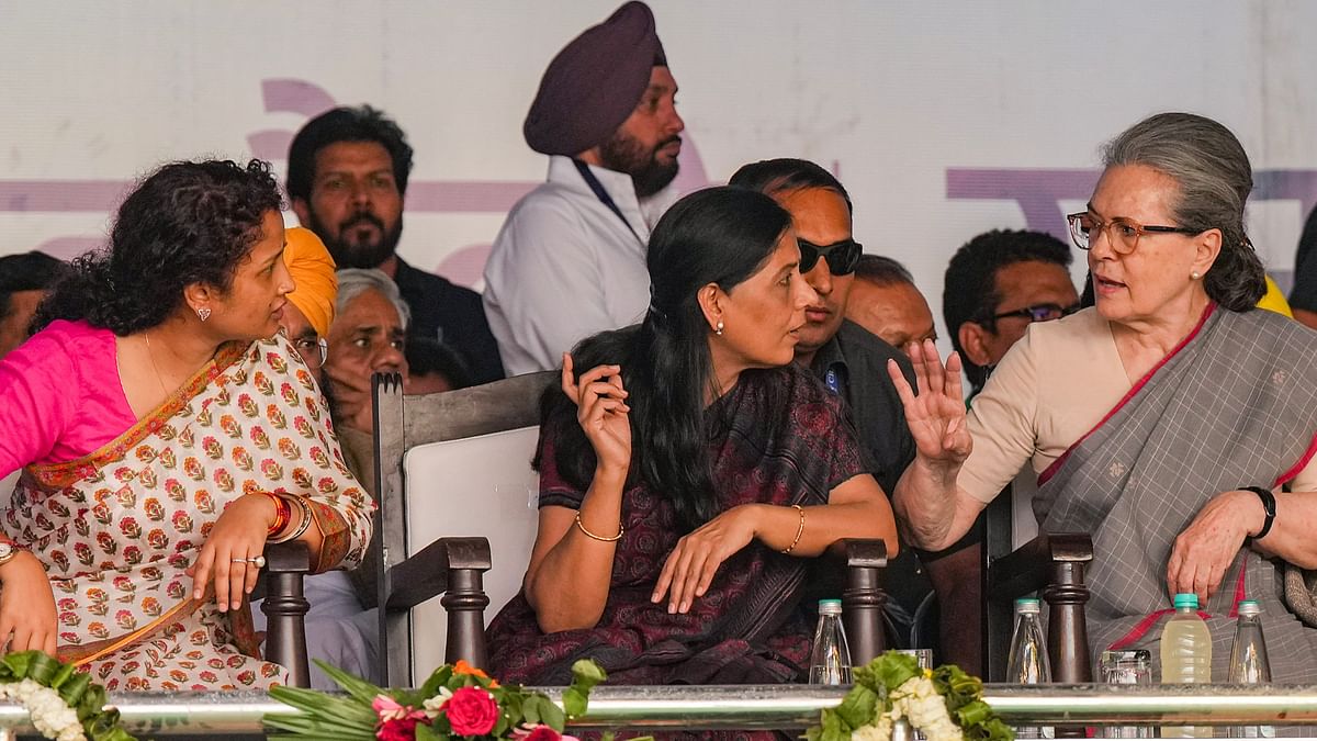 Congress leader Sonia Gandhi talks with Sunita Kejriwal and Kalpana Soren during I.N.D.I.A. bloc's 'Loktantra Bachao Rally' at Ramlila Maidan, in New Delhi